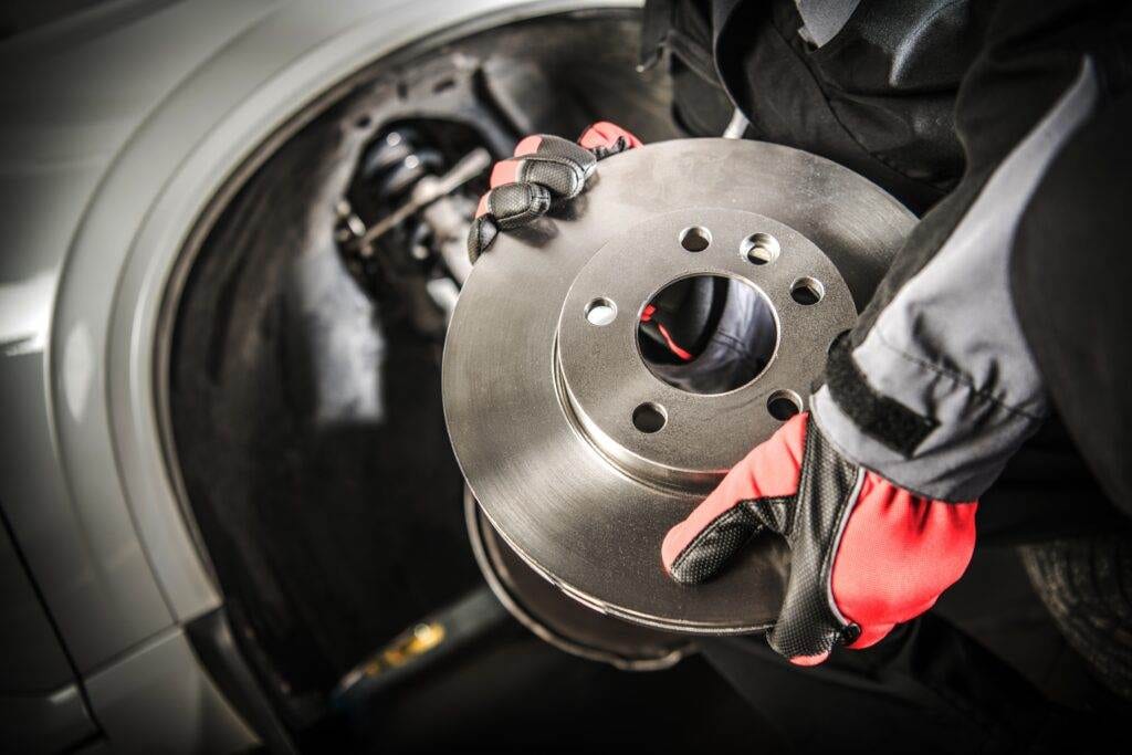 Mechanic Holding a cars Brake Rotor