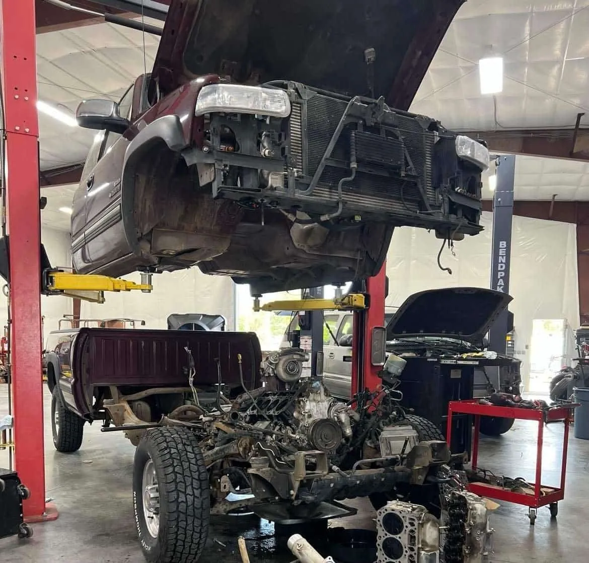 a car on a lift in a garage