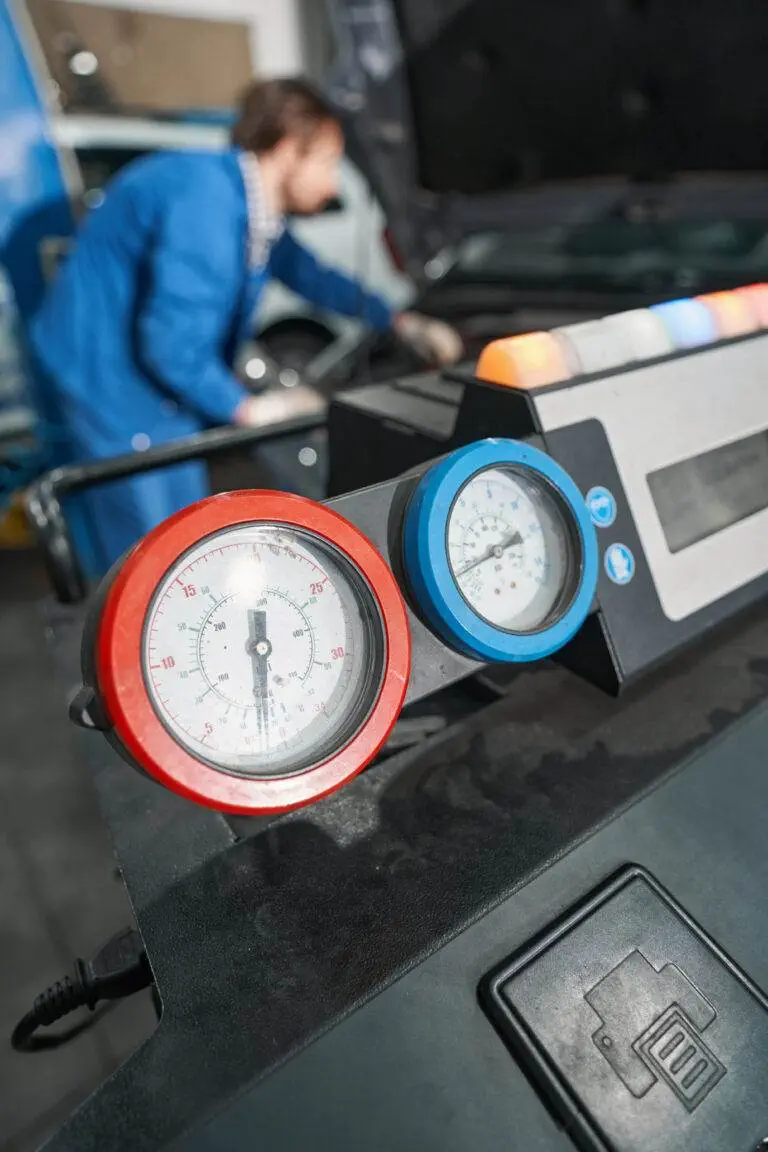 a close-up of a gauge for automotive AC repair